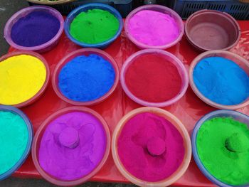 High angle view of multi colored powder for sale at market