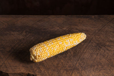 Close-up of corn on wooden table