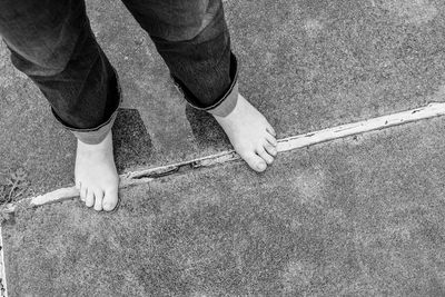 Low section of man standing on floor