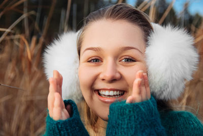 Young beautiful girl on the coast in winter