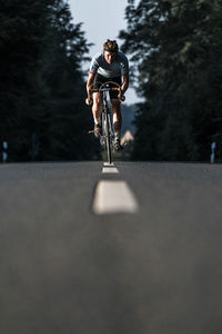 Man riding bicycle on street