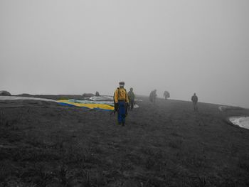 Full length of woman standing on landscape