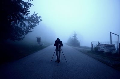 Silhouette of man with camera