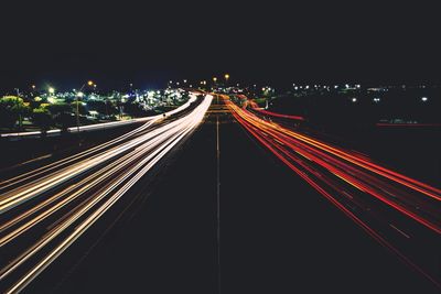 High angle view of light trails on highway at night