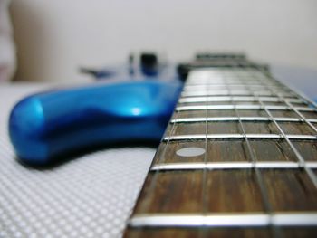 Close-up of guitar on table