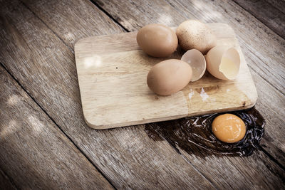 High angle view of eggs on cutting board