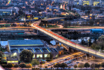 High angle view of illuminated cityscape at dusk