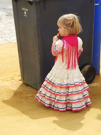 Full length of woman standing on slide