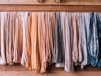 Close-up of textiles hanging on wood