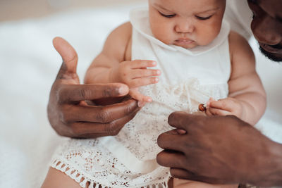 Midsection father playing with daughter