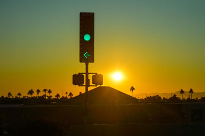 Sunset traffic lights in phoenix, arizona.