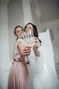 Young woman drinking glass with drink