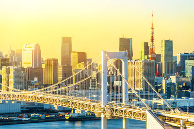 View of bridge and buildings against sky