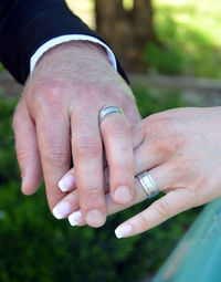 Close-up of couple holding hands