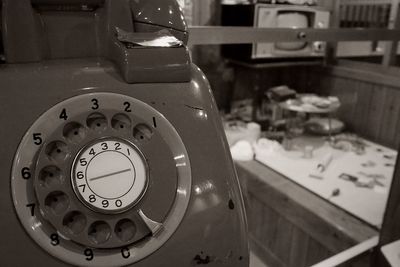 Close-up of telephone booth on table