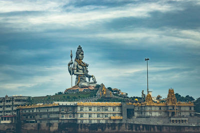 Murdeshwar shiva statue morning view from low angle with sea waves