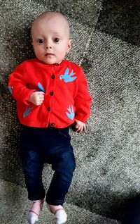 Portrait of cute boy standing outdoors