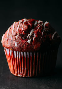 Close-up of cake against black background