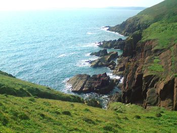 Scenic view of sea and cliff