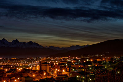 High angle view of illuminated buildings in city at night