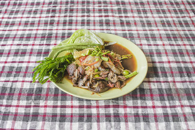 High angle view of vegetables in plate on table