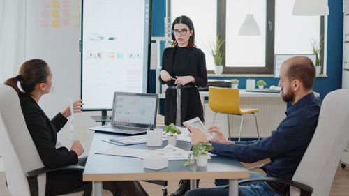 Business colleagues working in office