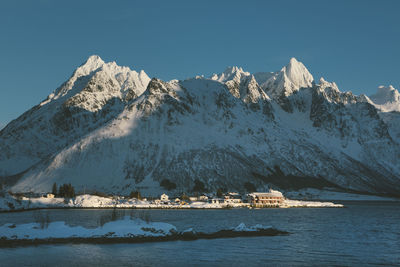 Scenic view of snowcapped mountains against clear sky