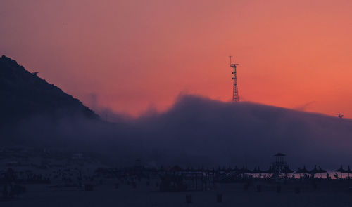 Scenic view of beach against sky during sunset