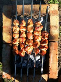 High angle view of meat on barbecue grill