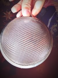 Close-up of person holding eyeglasses