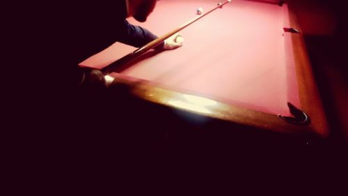 View of woman in dark room