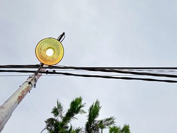 Low angle view of street light against sky