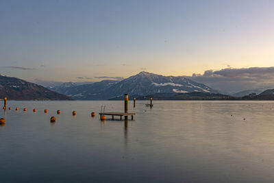 Scenic view of sea against sky during sunset in cham zugersee