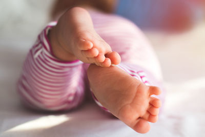 Low section of baby feet