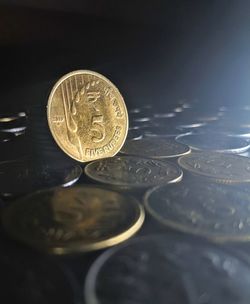 Close-up of coins on table