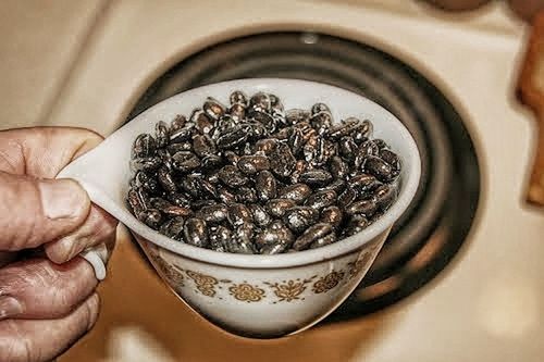 human hand, hand, human body part, one person, holding, food and drink, food, indoors, abundance, freshness, adult, close-up, large group of objects, bowl, drink, preparation, focus on foreground, high angle view, healthy eating, silver colored