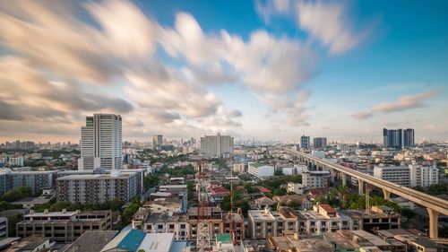 High angle view of buildings in city against sky