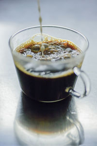 Close-up of coffee cup on table