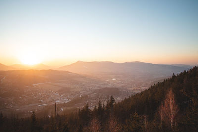 Scenic view of mountains against clear sky during sunset