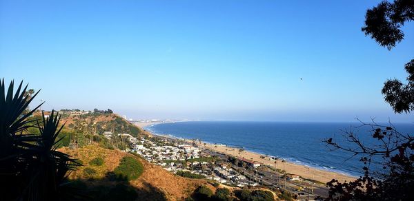 Scenic view of sea against clear blue sky