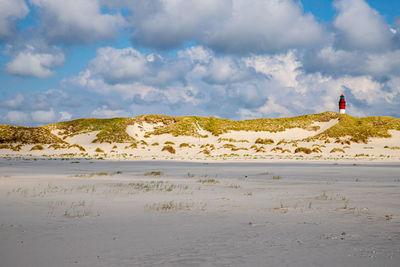 Amrum lighthouse behind dunes