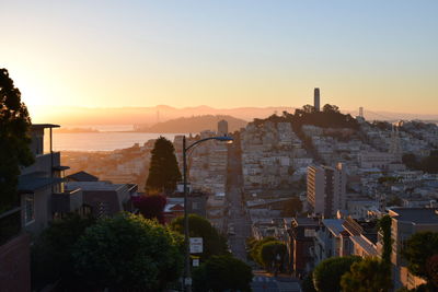 View of cityscape against sky during sunset