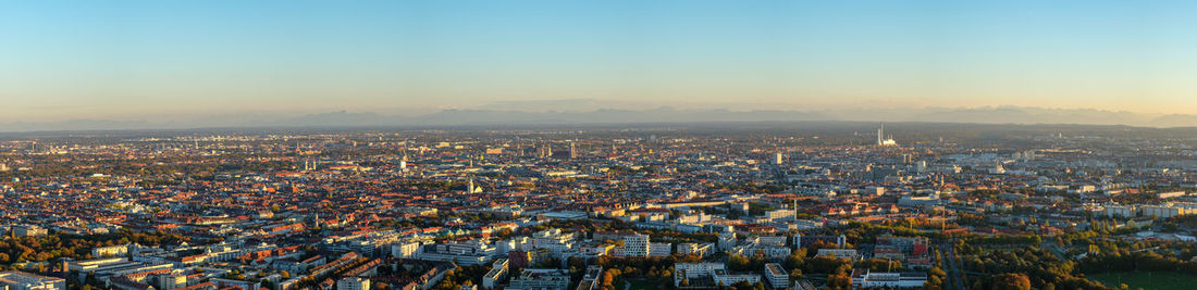 Munich panorama scene skyline with alps in evening light