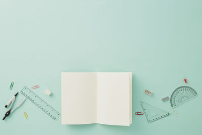 High angle view of colored pencils on white background