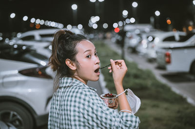 Series photo of young woman tourist wear surgical medical mask touring in street night market