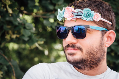 Close-up of smiling bearded man wearing headband