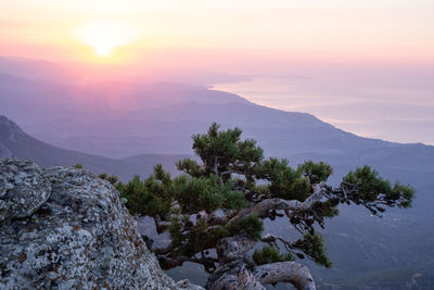 Scenic view of mountains against sky during sunset