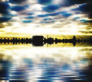 Silhouette of people in water at sunset