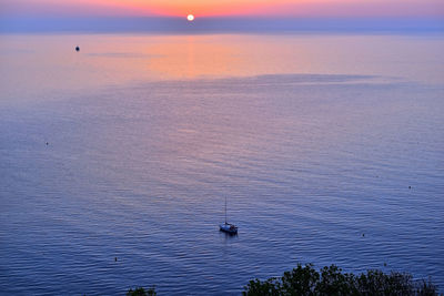 Scenic view of sea against sky at sunset