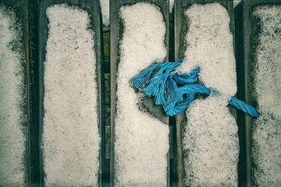 Directly above shot of rope on snow covered walkway